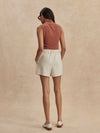 ivory chino style tailored shorts with double buttons and pleat detailing from varley rear view