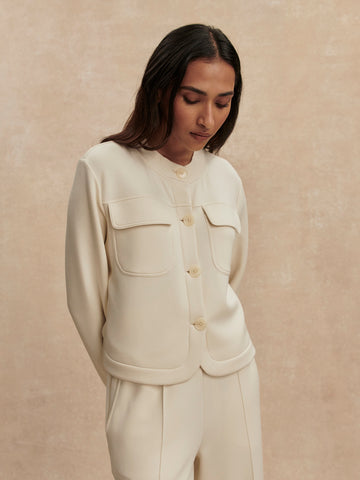 round neck soft sweat jacket with 2 flap pockets and large cream buttons from varley