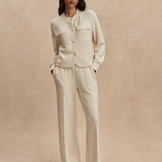 round neck soft sweat jacket with 2 flap pockets and large cream buttons from varley model shot