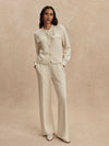 round neck soft sweat jacket with 2 flap pockets and large cream buttons from varley model shot