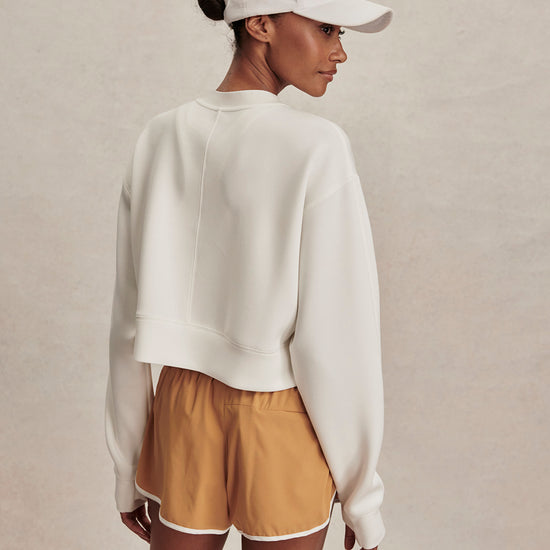round neck ivory sweatshirt with piping down the centre from varley rear view