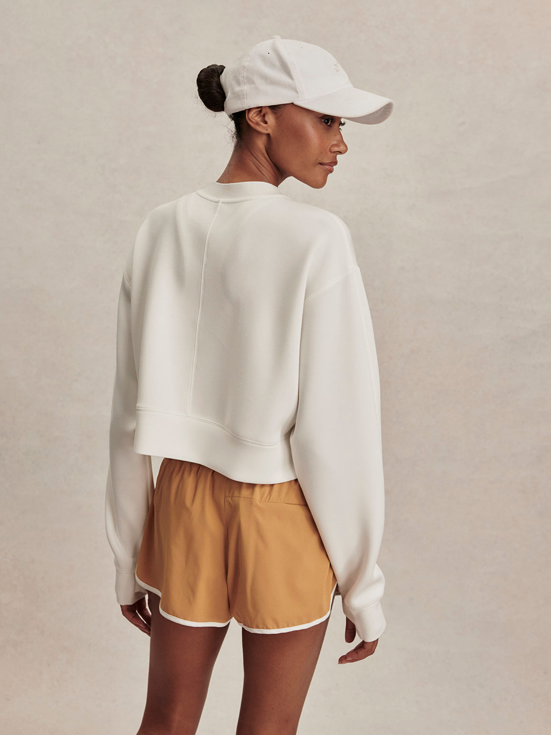 round neck ivory sweatshirt with piping down the centre from varley rear view