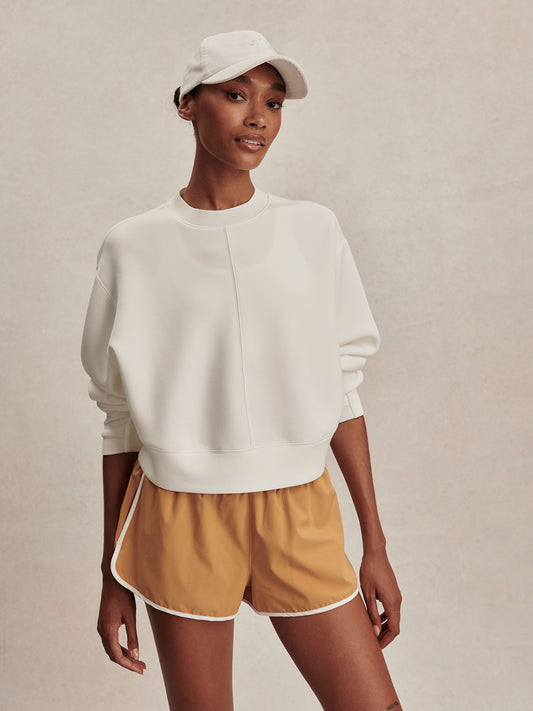 round neck ivory sweatshirt with piping down the centre from varley