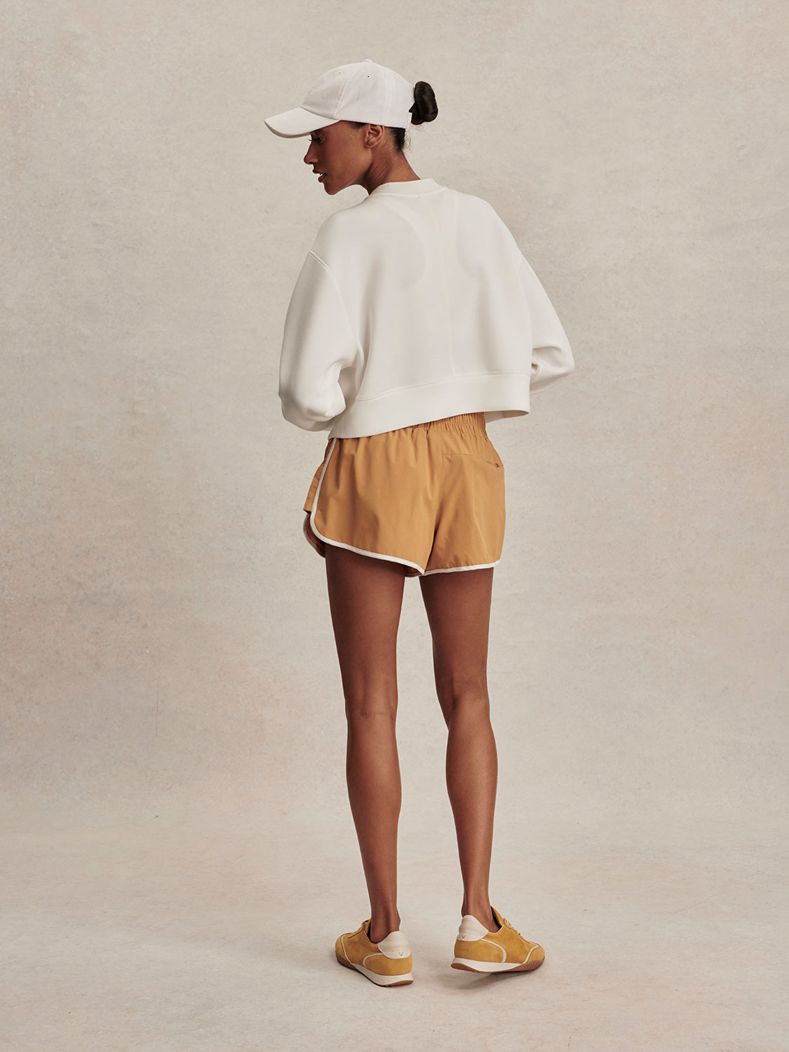 round neck ivory sweatshirt with piping down the centre from varley rear view