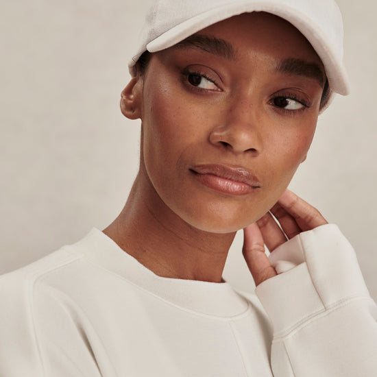 round neck ivory sweatshirt with piping down the centre from varley close up