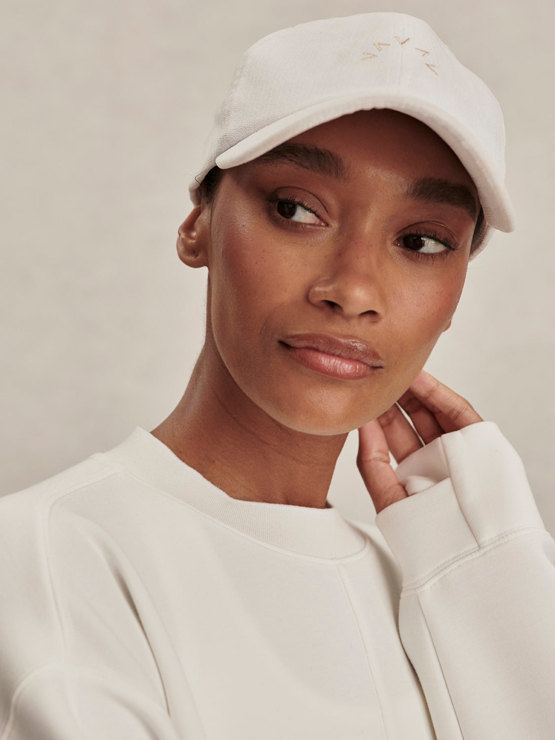 round neck ivory sweatshirt with piping down the centre from varley close up