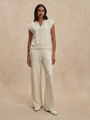 wide leg ivory sweat pants with central piping seam and elasticated waist from varley model shot