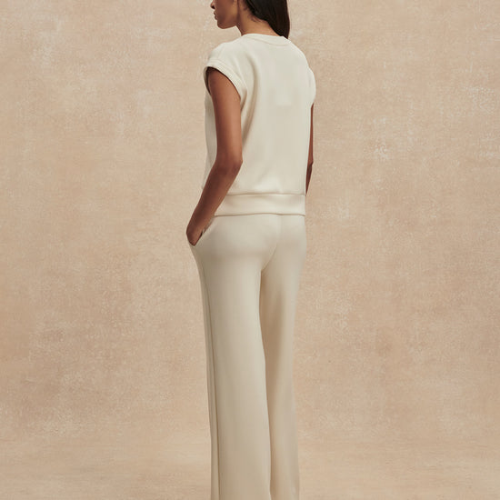 wide leg ivory sweat pants with central piping seam and elasticated waist from varley rear view