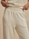 wide leg ivory sweat pants with central piping seam and elasticated waist from varley close up