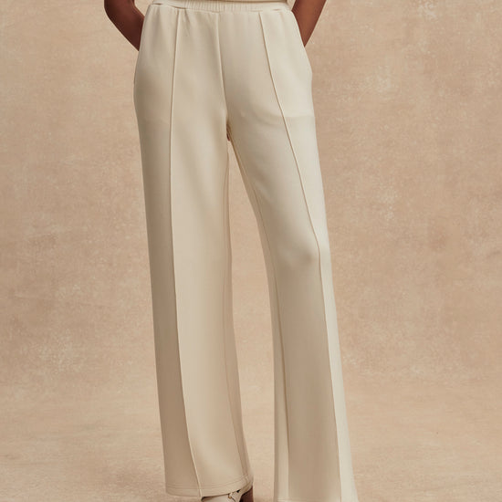 wide leg ivory sweat pants with central piping seam and elasticated waist from varley