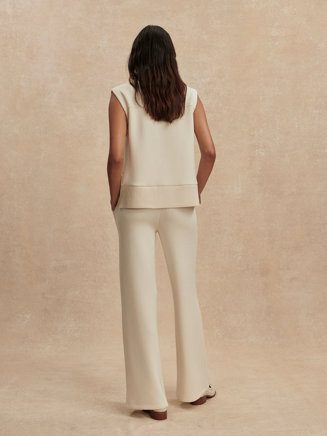 wide leg ivory sweat pants with central piping seam and elasticated waist from varley rear view