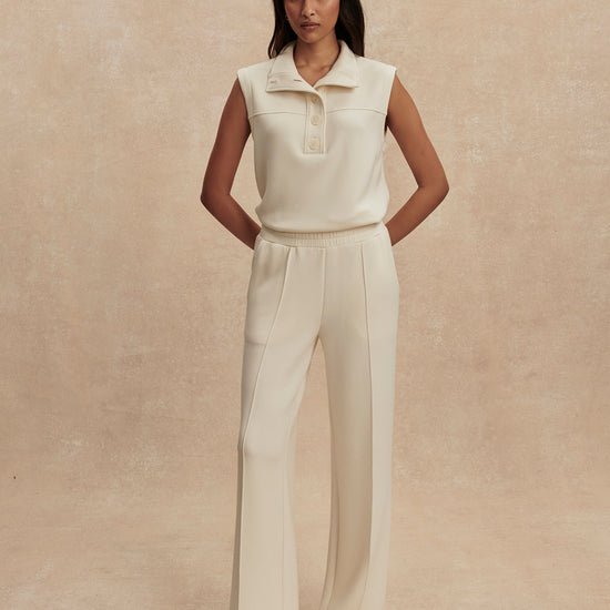 wide leg ivory sweat pants with central piping seam and elasticated waist from varley model shot