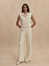 wide leg ivory sweat pants with central piping seam and elasticated waist from varley model shot