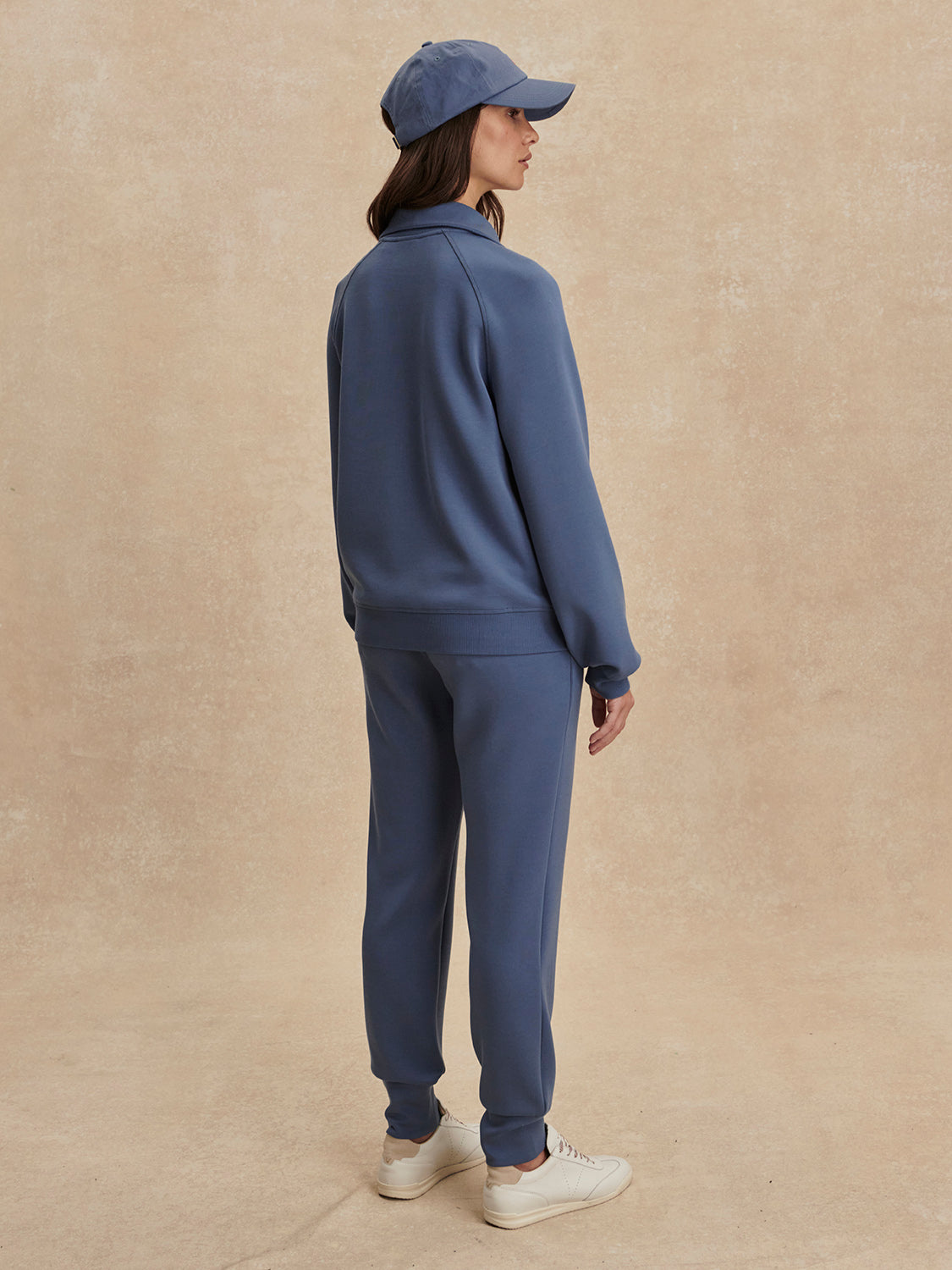 blue sweatshirt with collar and half zip from varley rear view