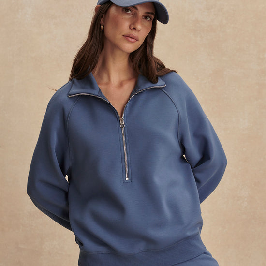 blue sweatshirt with collar and half zip from varley model shot