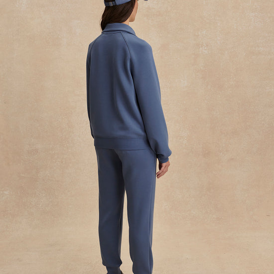 blue slim cuff sweat pants with elasticated waistband from varley rear view