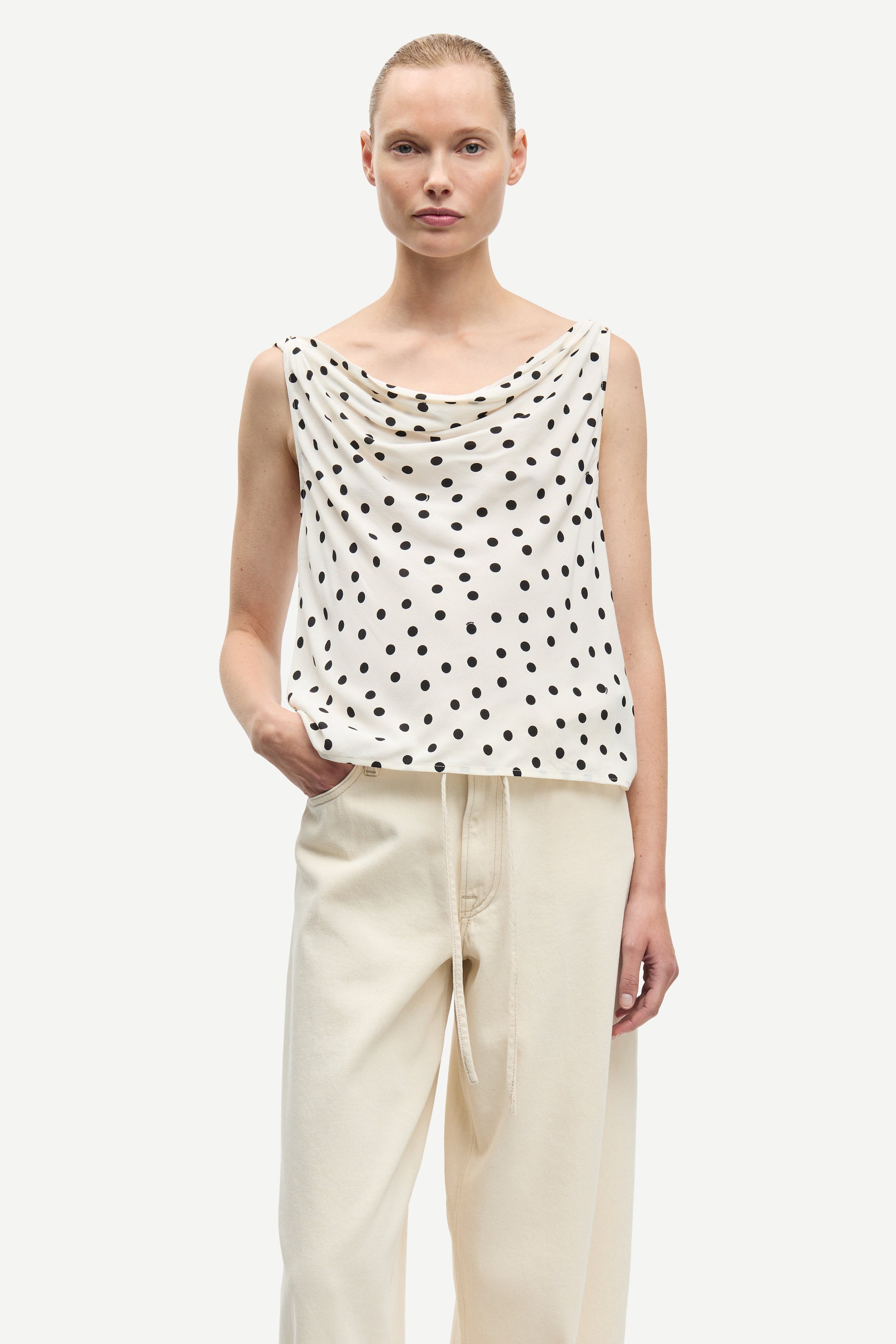 white cowl neck polka dot sleeveless top from samsoe model shot
