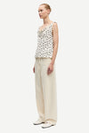 white cowl neck polka dot sleeveless top from samsoe model shot