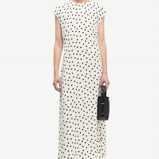 polka dot white mid length dress with cap sleeves and round neck from samsoe  model 