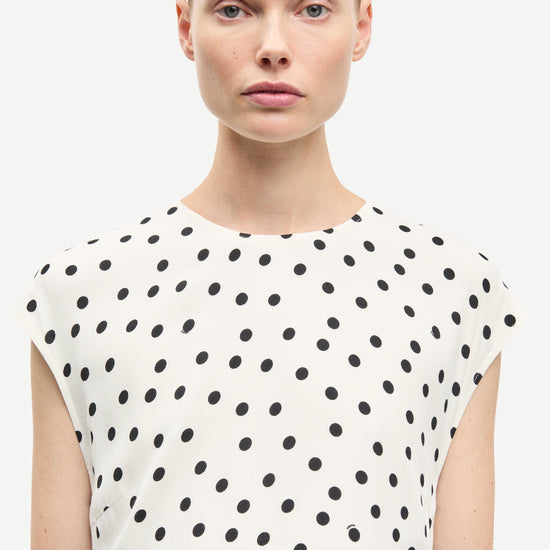 polka dot white mid length dress with cap sleeves and round neck from samsoe  close up