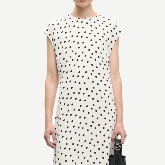 polka dot white mid length dress with cap sleeves and round neck from samsoe  close up