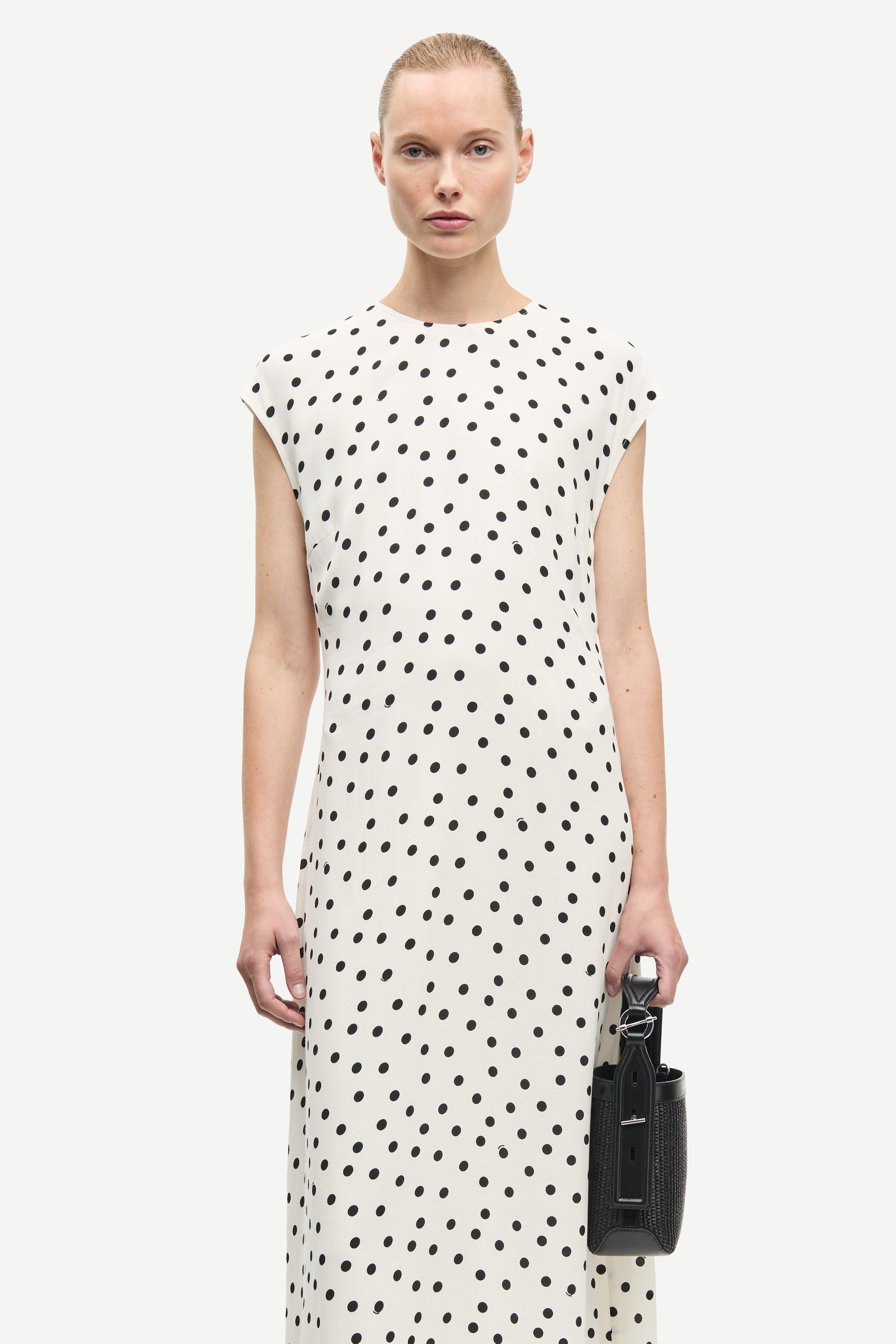 polka dot white mid length dress with cap sleeves and round neck from samsoe  close up