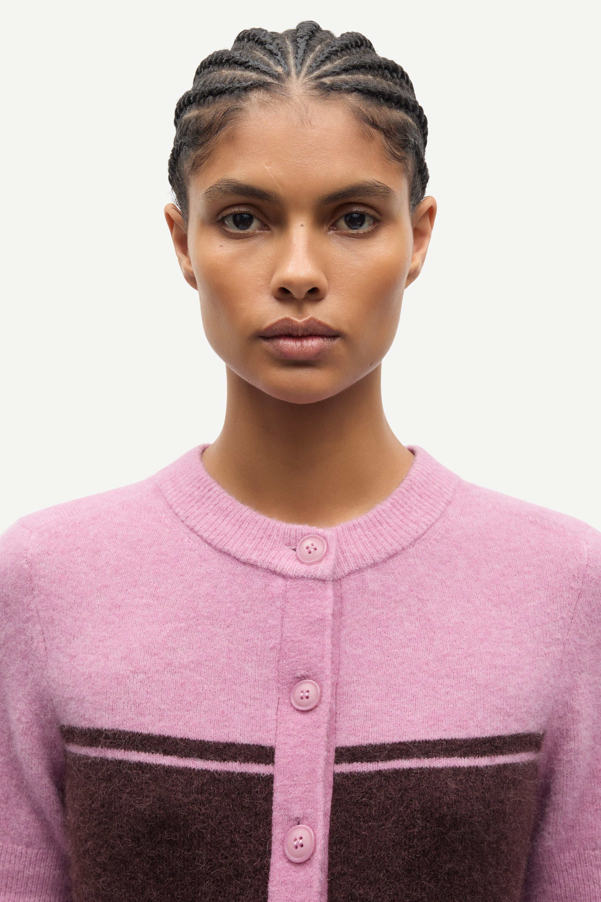 round neck short sleeve pink cardigan with burgundy stripe across the chest from samsoe model shot