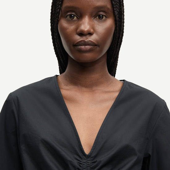 v neck short sleeve black short dress with rouch detailing from samsoe close up