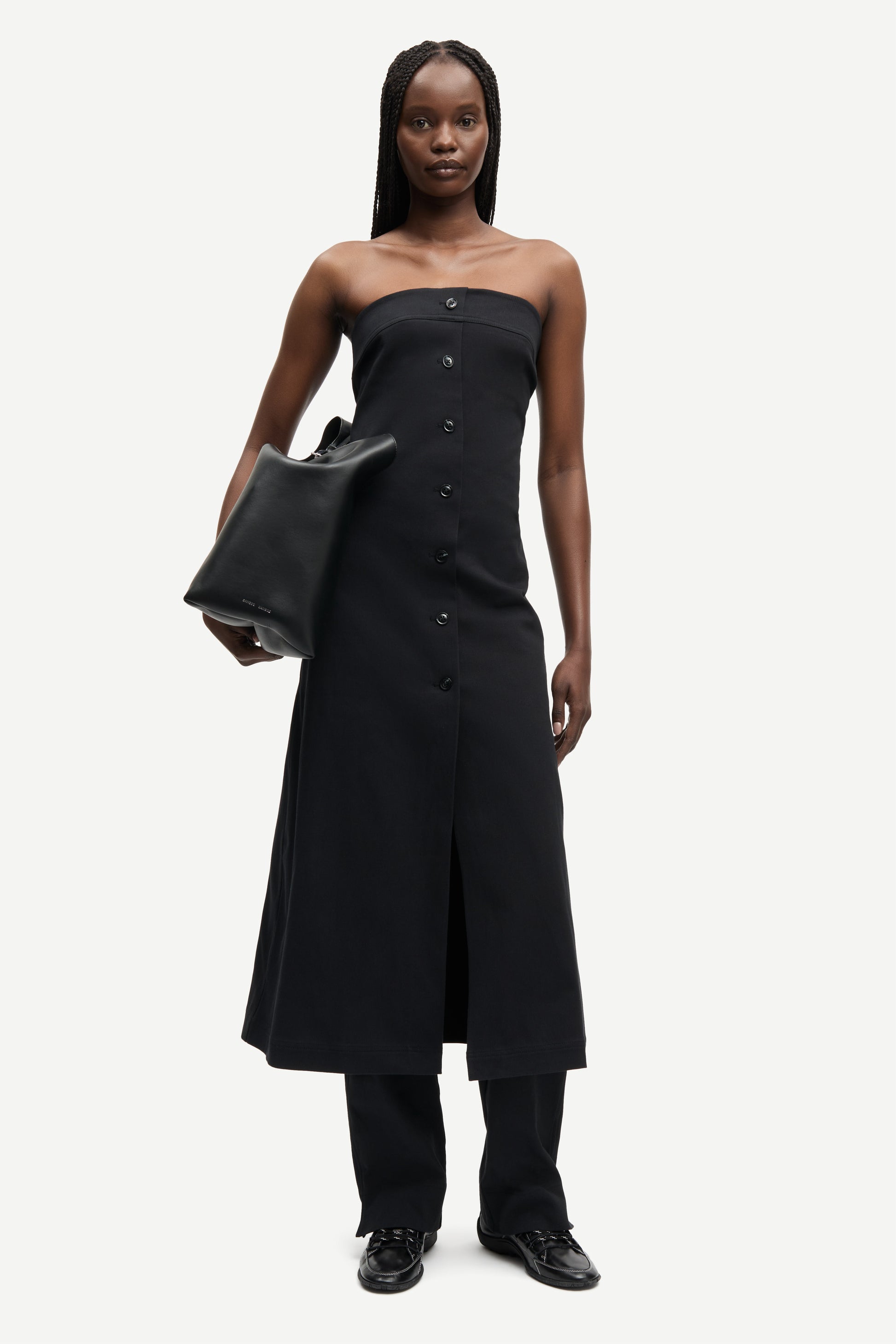 strapless mid length black dress with button down and a line shape from samsoe model shot