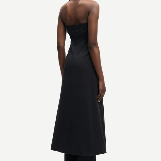 strapless mid length black dress with button down and a line shape from samsoe rear 