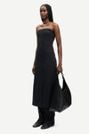 strapless mid length black dress with button down and a line shape from samsoe side view