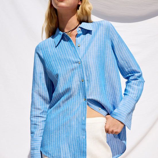 blue pinstripe linen shirt with shiny buttons from rails model shot