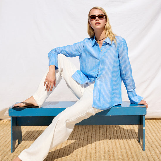 blue pinstripe linen shirt with shiny buttons from rails model shot