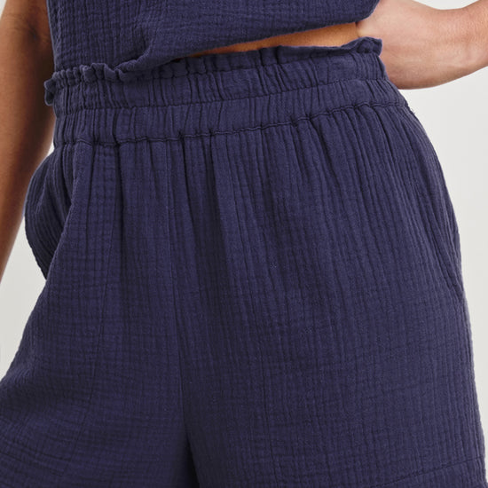 cheesecloth fabric dark blue shorts with elasticated waist and pockets model shot