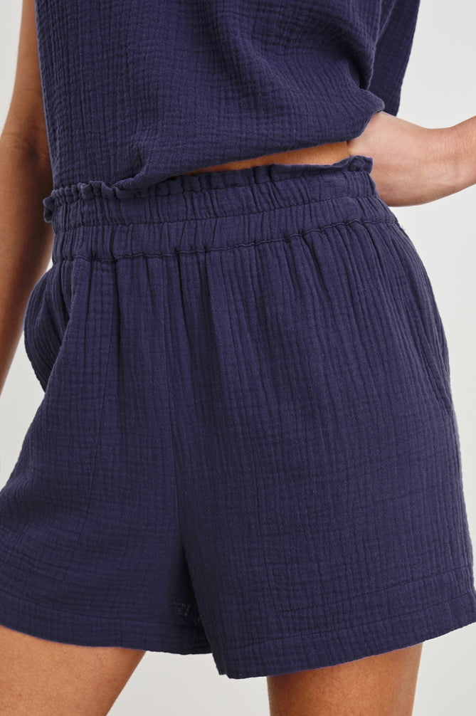 cheesecloth fabric dark blue shorts with elasticated waist and pockets model shot