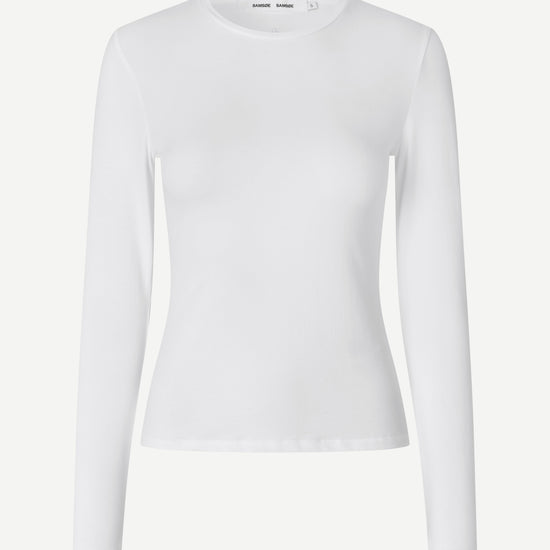 Flat lay on white long sleeve organic cotton tee