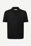 Black extra fine merino wool polo shirt on a white background from Samsoe Samsoe