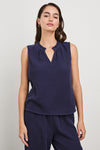 Blue cheesecloth sleeveless top with v neck and ruffle collar model