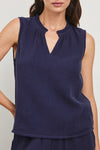 Blue cheesecloth sleeveless top with v neck and ruffle collar model