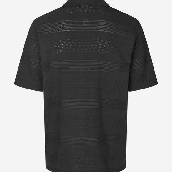 Black textured shirt on a white background