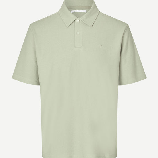 Light green polo shirt on a white background