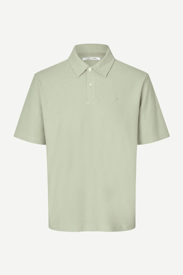 Light green polo shirt on a white background