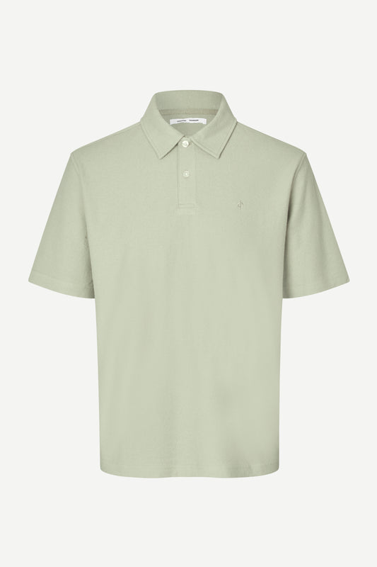 Light green polo shirt on a white background