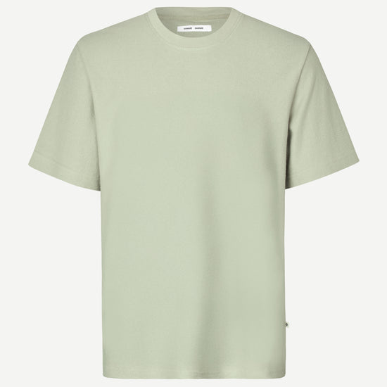 Light green t-shirt on a white background