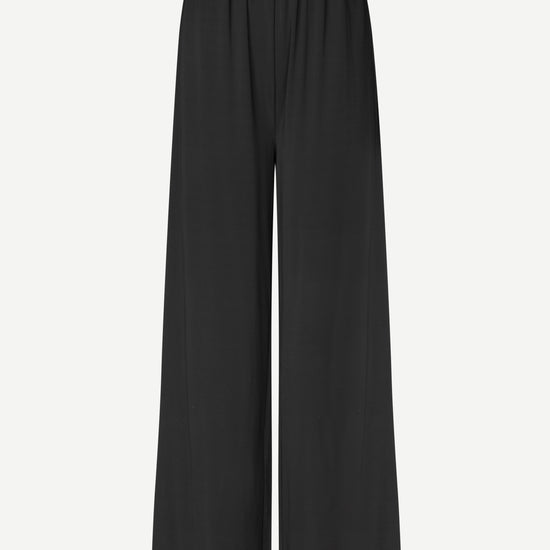 Black pants with subtle design on a light gray background