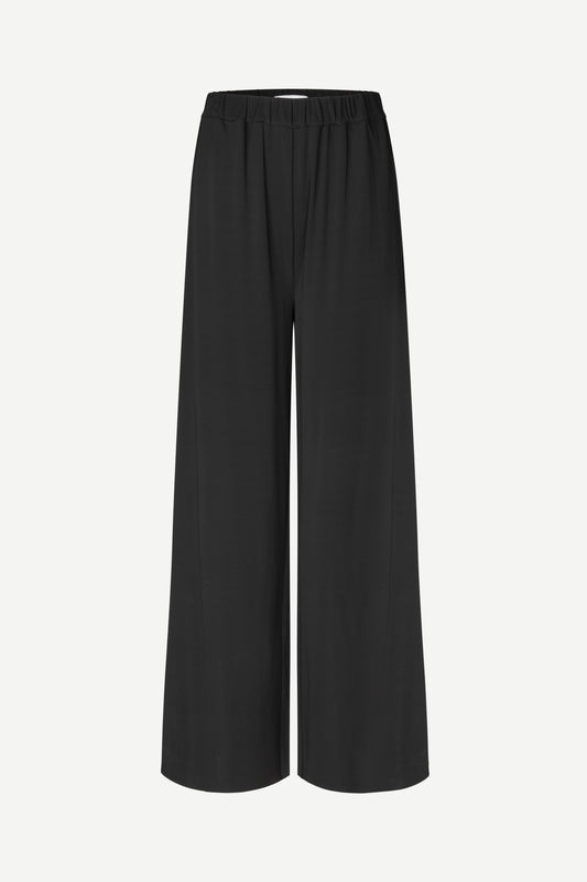 Black pants with subtle design on a light gray background