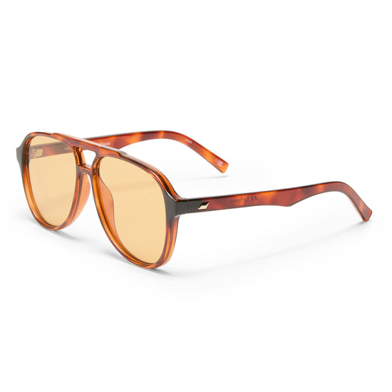 Tortoise shell Le Specs sunglasses on a white background side view