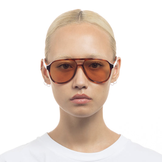 Tortoise shell Le Specs sunglasses on a female model