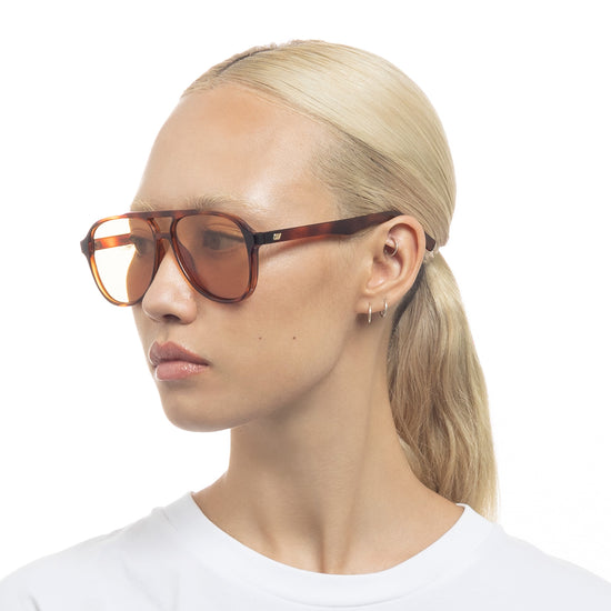 Tortoise shell Le Specs sunglasses on a female model side view