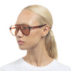 Tortoise shell Le Specs sunglasses on a female model side view